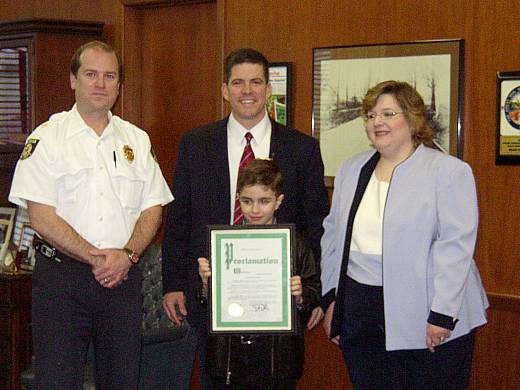 Presentation of Proclamation to a local child at City Hall.