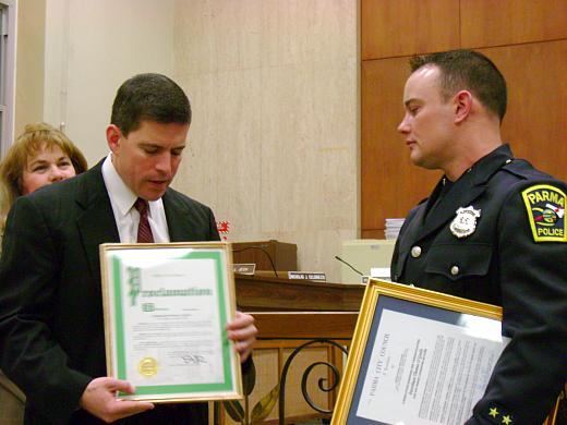 Mayor DePiero commends Officer Thomas O'Grady for helping another department while off-duty.